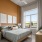 Furnished model apartment bedroom with a large window at Aventon Gem Lake