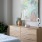 Dresser with decorations in apartment bedroom at Aventon Gem Lake