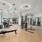 Maitland, FL Pet-Friendly Luxury Apartments - Gem Lake - Fitness Center with Weight Lifting Equipment and Floor-to-Ceiling Windows
